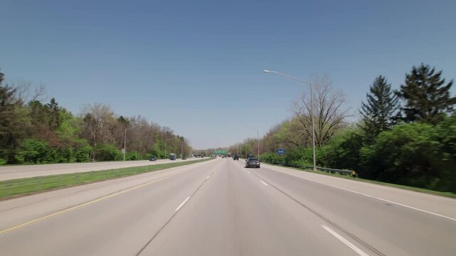 Car traffic driving on multiple lanes highway and interstate 315 and 270 belt outside Columbus, Ohio in midwest American roadway turnpike near northern city traffic by Worthington, OH