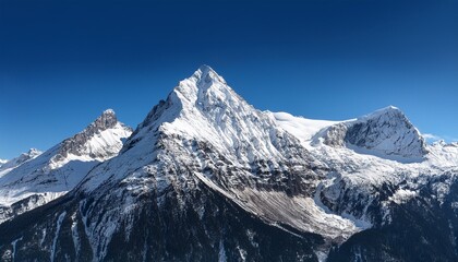 Obraz premium snow covered mountain peak with sharp ridges and clear blue sky isolated on transparent background