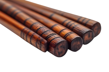 Closeup of elegant dark brown wooden chopsticks detailed texture black background