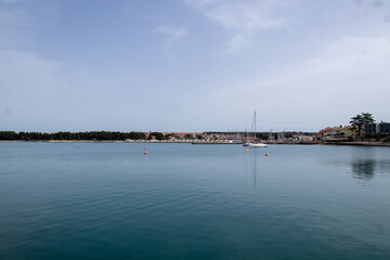 Fototapeta premium Landscape view of the City of Novigrad, Croatia during calm sea and sunny day. Spring time