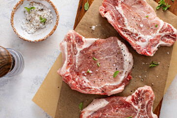 Pork chops on a bone ready to be grilled or seared