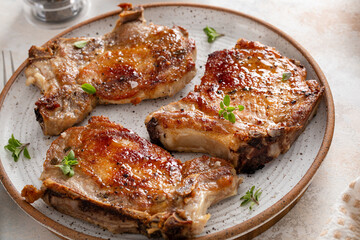 Pork chops grilled or seared on a serving plate