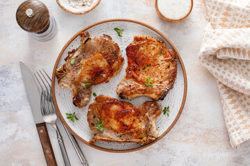 Pork chops grilled or seared on a serving plate