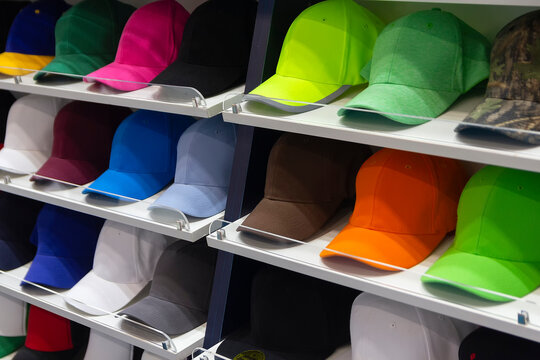 Colorful caps neatly displayed on shelves in an shop