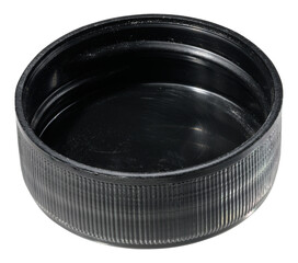 A round, black plastic bottle cap with a ribbed exterior and a smooth inner surface, isolated background