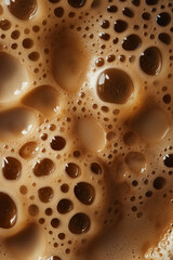 Foamy coffee surface with bubbles and crema. Beverage texture concept.