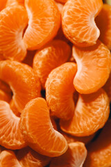 peeled tangerine slices, food background, delicious fruits, useful citrus vitamins concept, pattern, texture, selective focus
