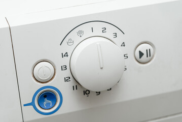 washing machine front panel and power buttons, closeup view