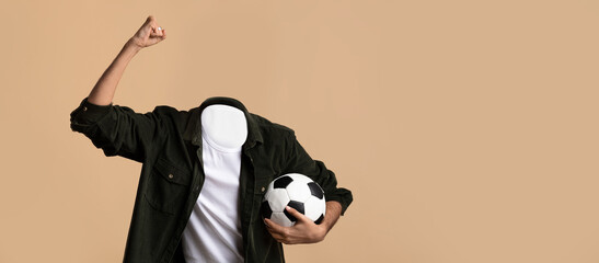 A person excitedly raises a fist in celebration, holding a soccer ball in the other hand. The individual is headless, showcasing a unique, playful lifestyle concept against a plain background.