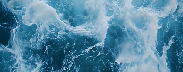 Obraz premium Dynamic ocean waves captured in vibrant blue hues, showcasing the power and beauty of nature. A mesmerizing display of the sea's movement and energy that inspires tranquility.