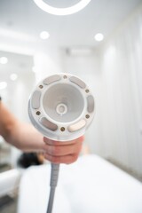 Device used for skin treatment in a modern spa during daylight hours