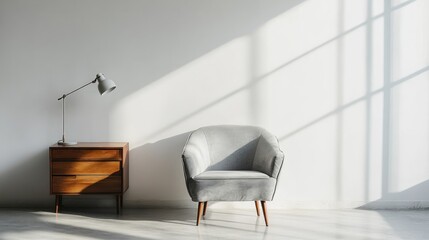 Minimalist room with a light gray chair and wooden nightstand.