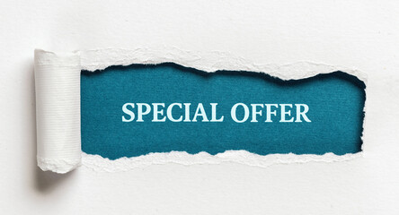 Special offer message in white text on torn paper with blue background for sale marketing discount...