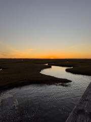  Sunset Over Meandering Marsh Creek Viewed from Wooden Railing