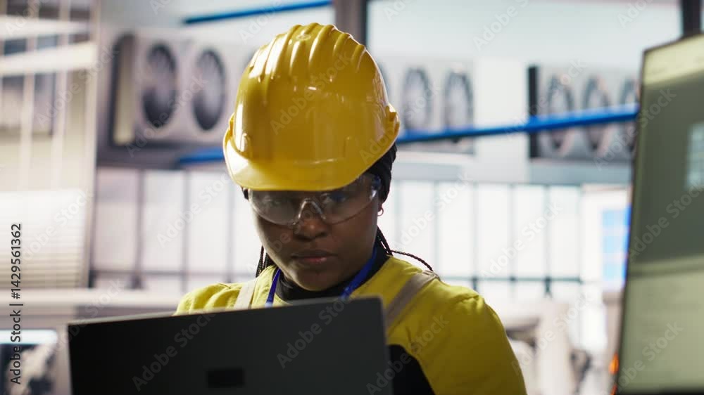 Poster smiling smart factory specialist testing automated systems to ensure reliability. happy engineer in 