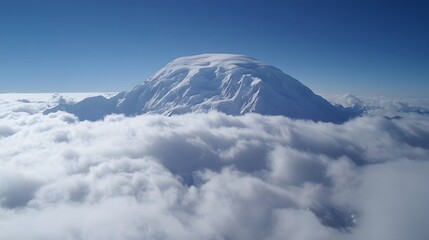 Majestic Snow Capped Mountain Peak Above Clouds
