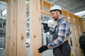 Portrait of a carpenter smiling with crossed arms in a lumber warehouse, showcasing expertise in...