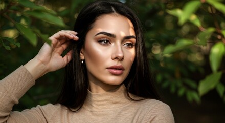 Naklejka premium Beautiful woman with long dark hair and neutral-toned clothing