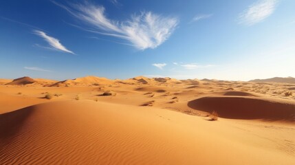 Vast desert landscape under a vibrant blue sky.  