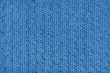 Texture of blue carpet fabric with large coarse textured weaving. Surface, structure of upholstery or rug material, cloth background close up, macro.