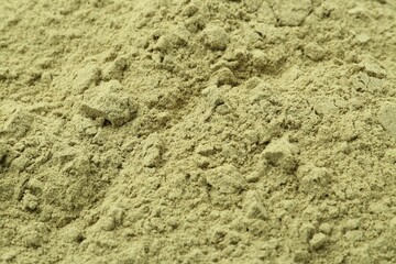 Superfood product. Pumpkin seeds powder as background, closeup