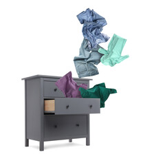 Clothes flying out of dresser on white background