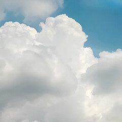 Obraz premium Soft White Cumulus Clouds against a Light Blue Sky Background
