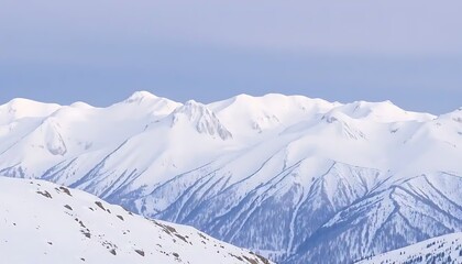 Majestic snow-covered mountains with soft lighting and clear atmosphere