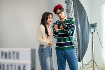 Behind the scenes of film crew collaborate on set under director's guidance. 