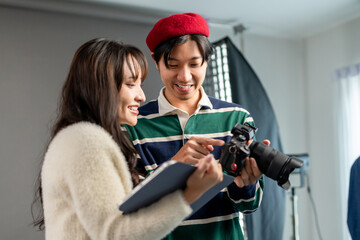 Behind the scenes of film crew collaborate on set under director's guidance. 