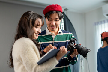 Behind the scenes of film crew collaborate on set under director's guidance. 