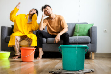 Water Drips into Buckets in Living Room, While Two Guys Calling Insurance Company Trying to Find...