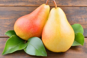 Two Ripe Pears on Wooden Background with Leaves