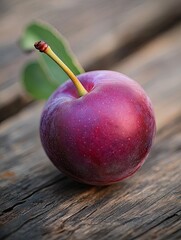 plum isolated on wooden background