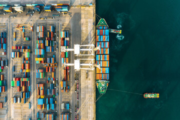 123456Next
Top view of a large cargo ship loading and unloading containers at a deep-sea port. This...
