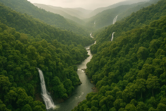 Breathtaking rainforest landscape with cascading waterfalls and serene river amidst lush greenery