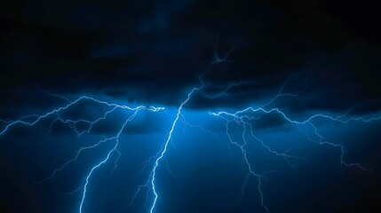 Fototapeta premium intense blue lightning fracturing across a dark