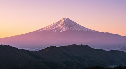 Fototapeta premium Mount Fuji with snow at sunset over dark mountain ridge