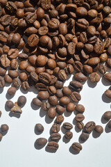 coffee beans, close up shot, texture shot, scattered coffee beans, background, coffee industry
