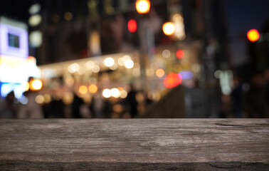 Empty wood table top and blur of restaurant background selective focus product display