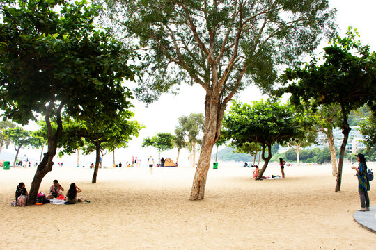 Chinese people and foreigner travelers travel relax on the beach and swimming in the sea at Repulse Bay in Hong Kong, China