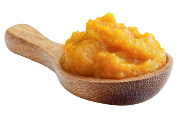 pumpkin puree in wooden spoon