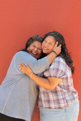 A 50-year-old divorced single mother and her 20-year-old Latina daughter show their love and spend time together to celebrate Mother's Day