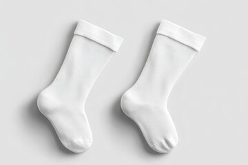 Pair of plain white socks displayed on a neutral background.