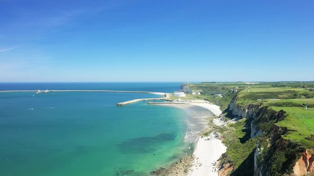 The port of Antifer protected by the green cliffs in Europe, France, Normandy, near Etretat, in summer, on a sunny day.&nbsp;