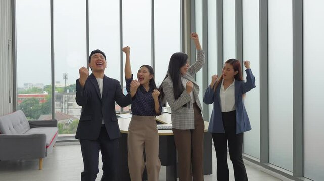 Businessmen congratulate each other on the success of sales exceeding the target, smooth business negotiations, shaking hands and applauding.