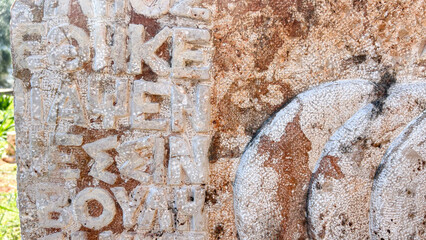 Ancient Greek Inscription On Weathered Stone Monument, Greece, Daylight, Concept Of Language History, Travel, Archaeology, Cultural Heritage, Educational Use, Sustainable Tourism