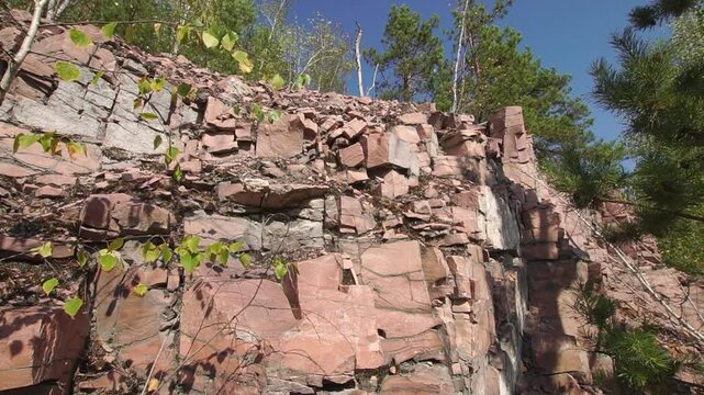 Quartzite rock close-up in a quarry on sunny summer day
