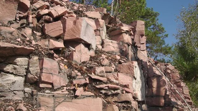 
Quartzite wall close-up wide angle tilt shot on summer day
