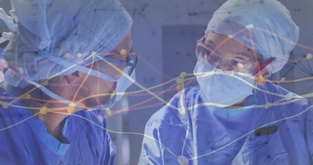 Female surgeons consulting in medical operating room, displaying animated data flow network overlay - Powered by Adobe